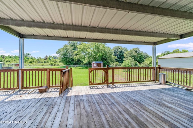 wooden terrace with a yard