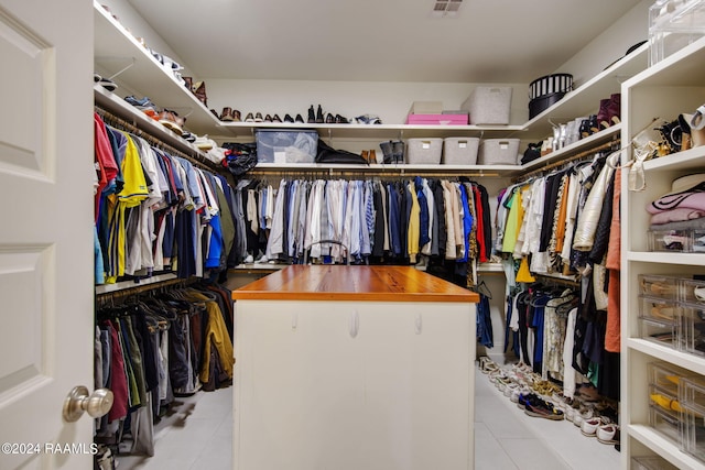 walk in closet featuring light tile patterned floors