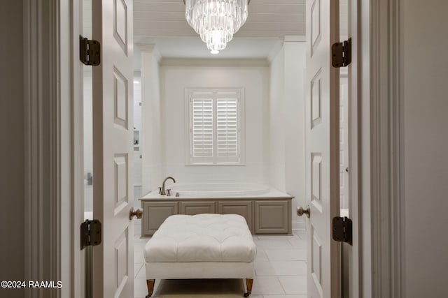 bathroom with a notable chandelier, a bathtub, crown molding, and tile patterned floors