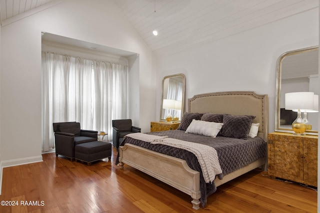 bedroom with wooden ceiling, wood-type flooring, and vaulted ceiling