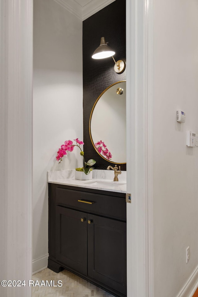 bathroom featuring vanity and crown molding