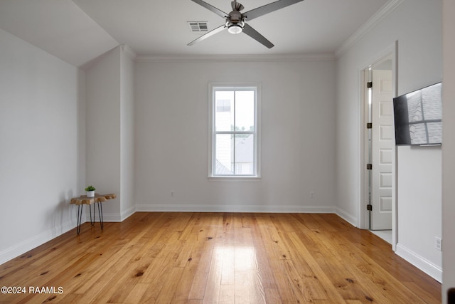 empty room featuring light hardwood / wood-style flooring, ceiling fan, and ornamental molding