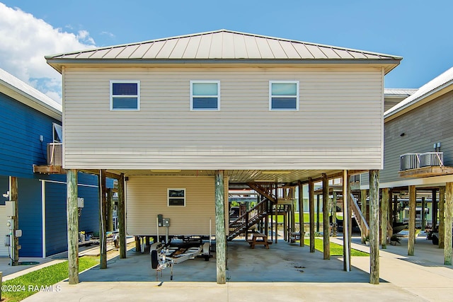 174 Trout Ct, Dulac, LA 70353 - exterior space with stairs, a carport, and concrete driveway