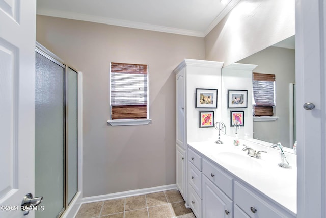 bathroom featuring crown molding, a shower with door, vanity, and tile patterned flooring