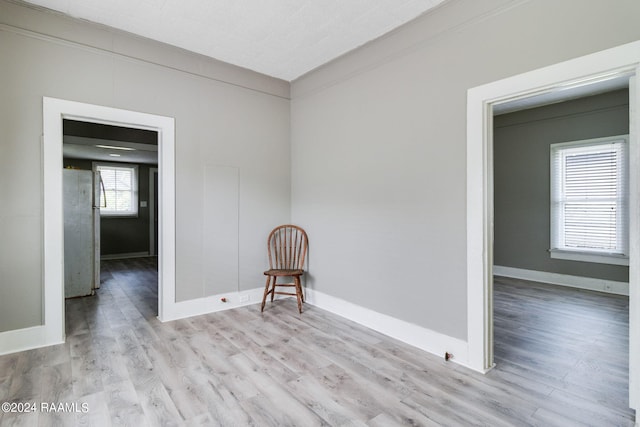 empty room featuring hardwood / wood-style floors and plenty of natural light