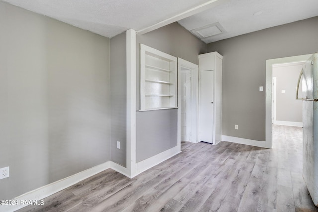 unfurnished room featuring light wood-type flooring