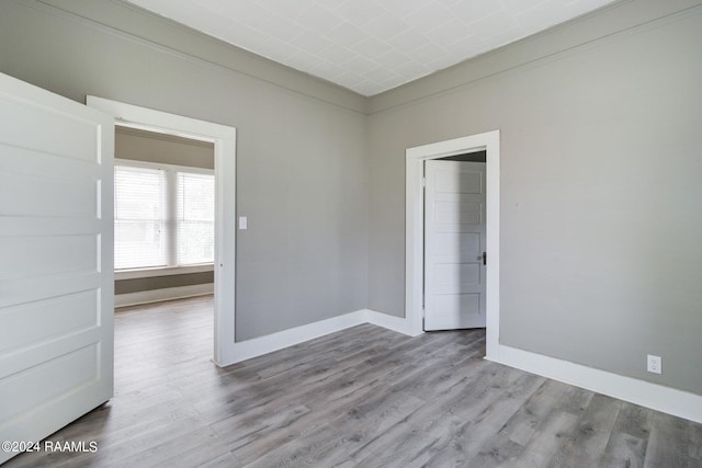 spare room featuring hardwood / wood-style flooring