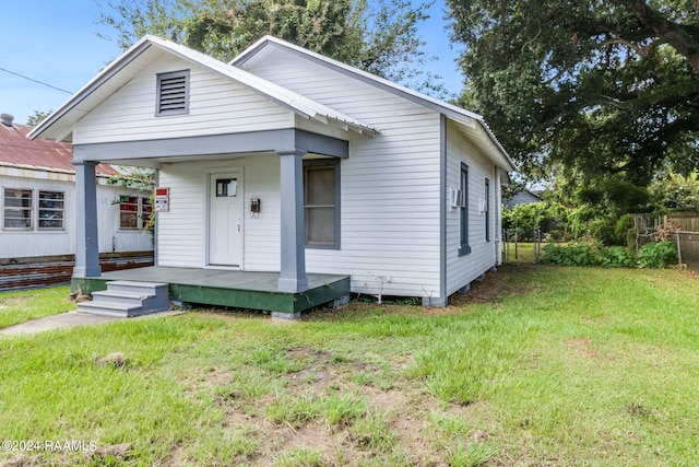 bungalow-style house featuring a front yard