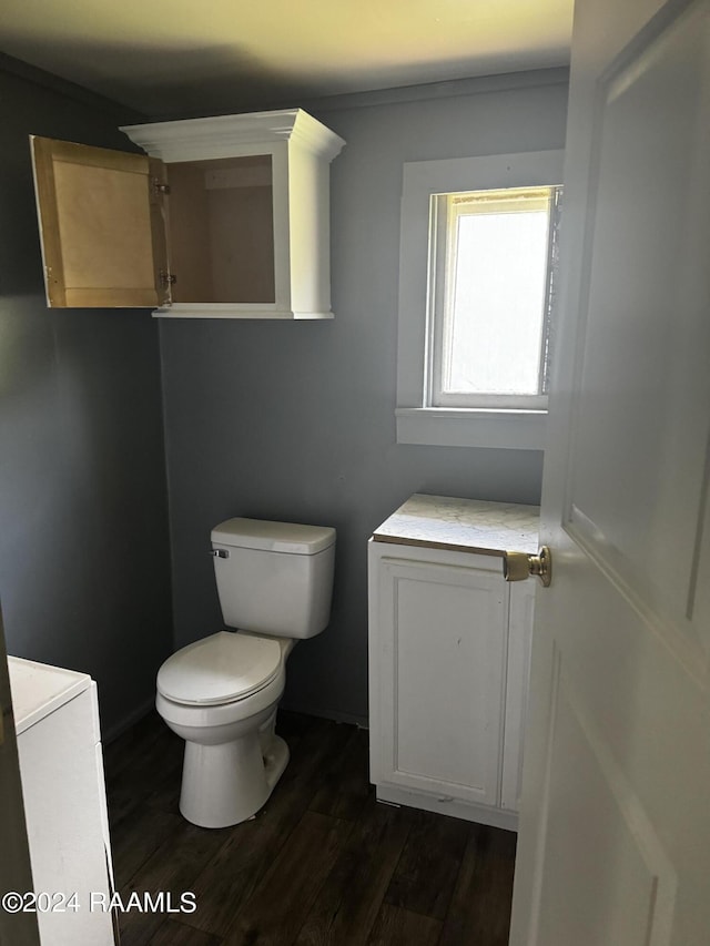 625 Malain St, New Iberia, LA 70560 - bathroom featuring toilet and hardwood / wood-style floors
