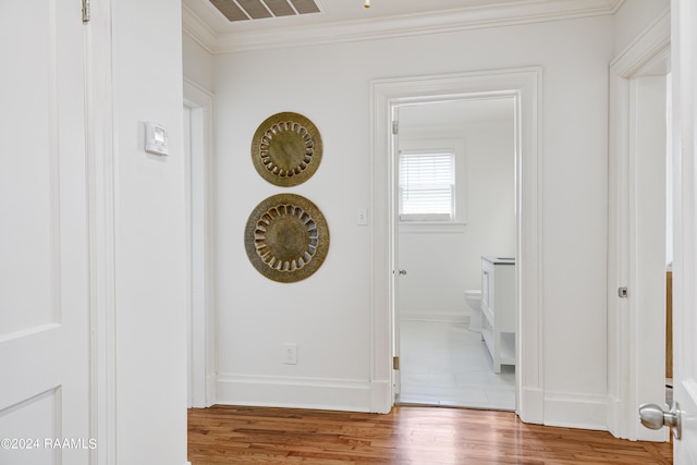 details featuring wood-type flooring and ornamental molding