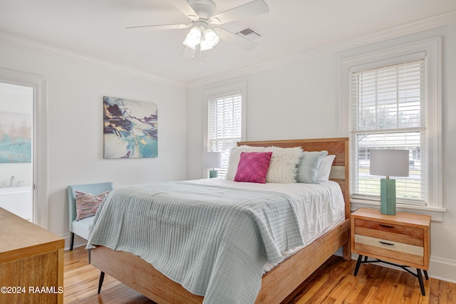 bedroom featuring ceiling fan, ornamental molding, and light wood-type flooring