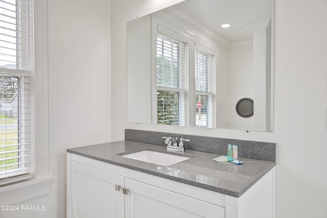 bathroom with vanity and crown molding