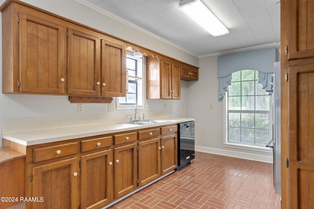 kitchen with a wealth of natural light, sink, ornamental molding, and black dishwasher