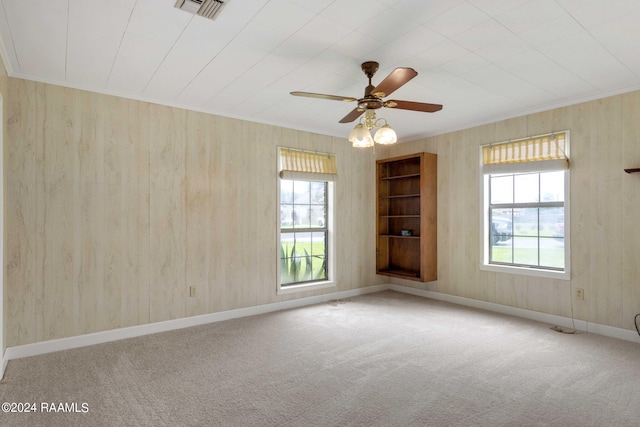 spare room with carpet floors and ceiling fan