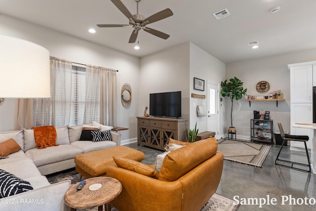 living room with concrete floors and ceiling fan