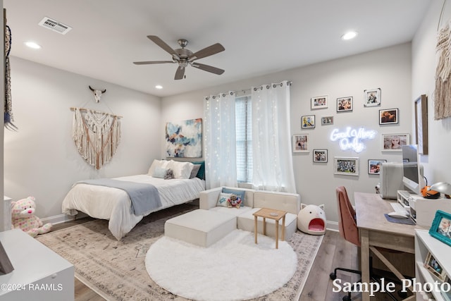 bedroom featuring ceiling fan and wood-type flooring