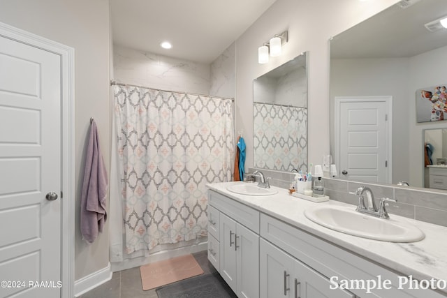 bathroom with tile patterned floors and vanity