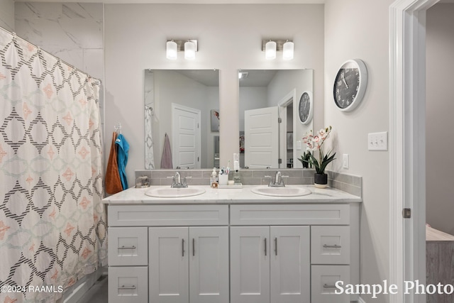 bathroom featuring vanity and a shower with shower curtain