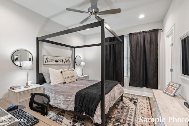 bedroom with wood-type flooring and ceiling fan