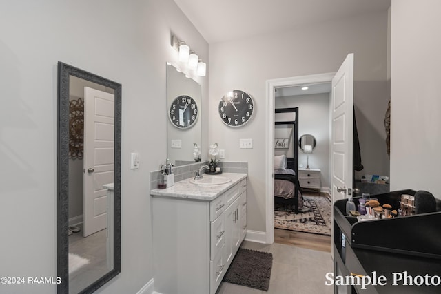 bathroom featuring vanity and tile patterned flooring