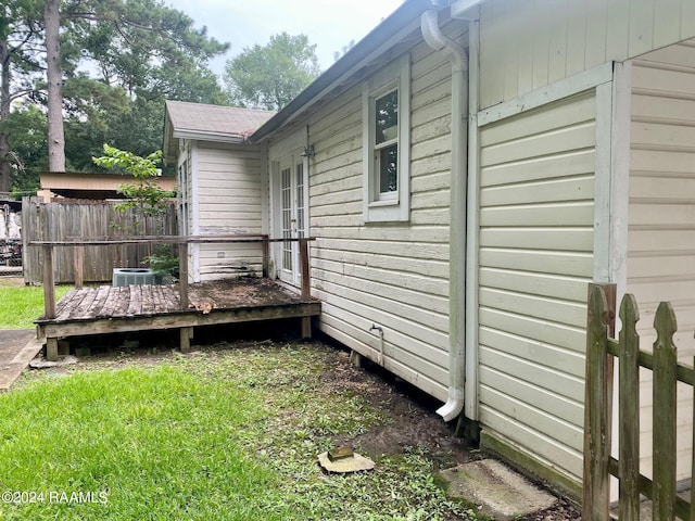 411 Rodney St, Eunice, LA 70535 - view of side of property featuring a wooden deck