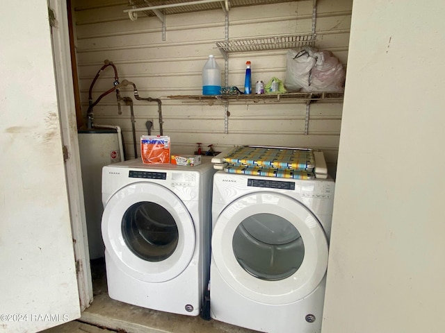 411 Rodney St, Eunice, LA 70535 - laundry area featuring washing machine and dryer and water heater
