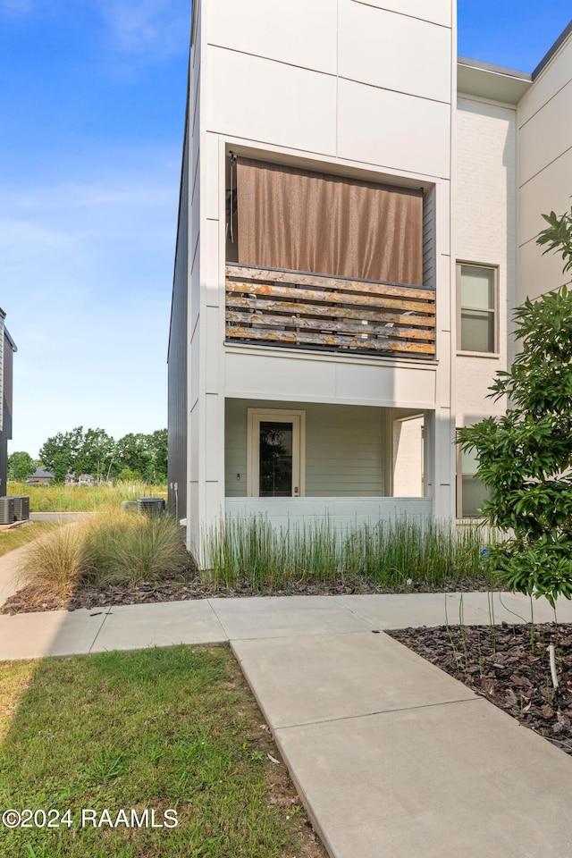 view of front of house featuring cooling unit