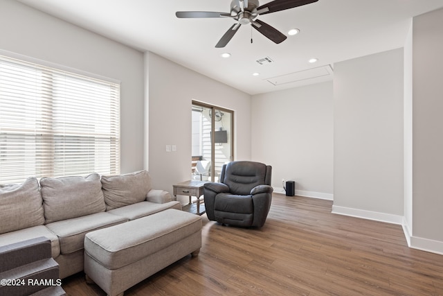 living room with ceiling fan and hardwood / wood-style floors