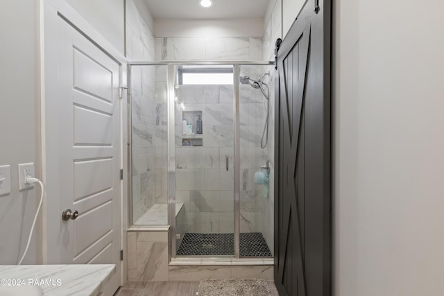 bathroom featuring an enclosed shower