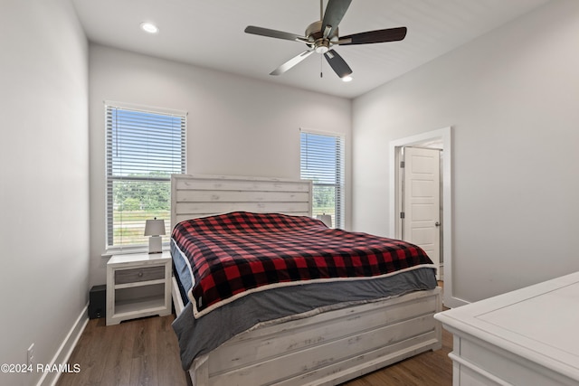 bedroom with ceiling fan and dark hardwood / wood-style floors