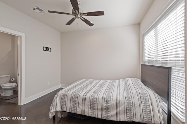 bedroom with ceiling fan and connected bathroom