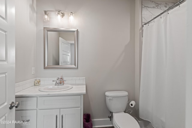 bathroom with toilet, a shower with shower curtain, and vanity