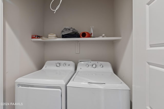 washroom featuring washing machine and dryer