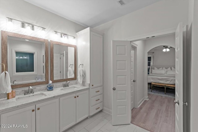 bathroom featuring vanity and ceiling fan