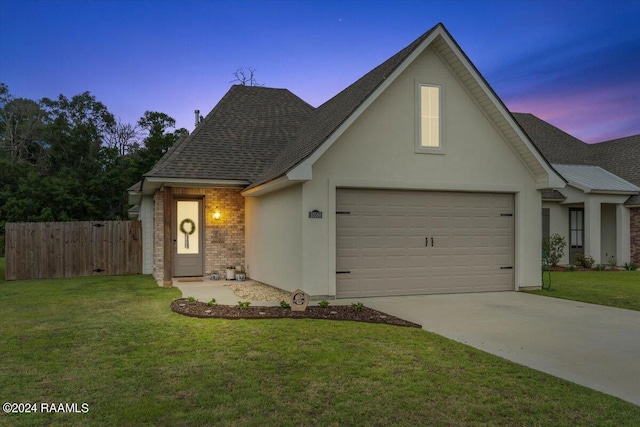 view of front of property with a yard