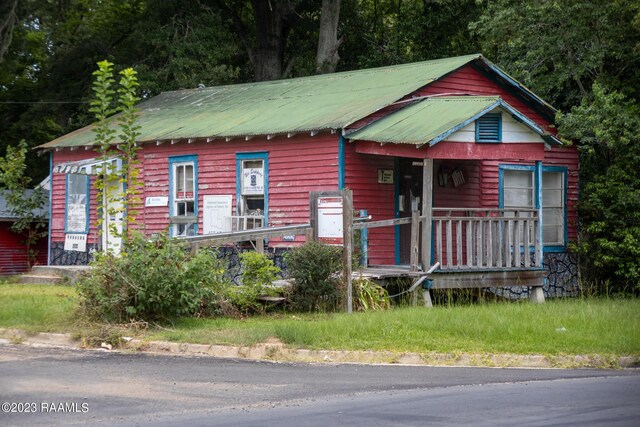 log-style house with a porch