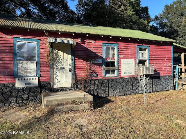 view of front of house featuring cooling unit