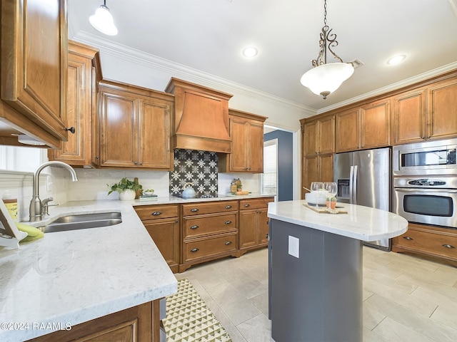 kitchen featuring hanging light fixtures, stainless steel appliances, custom range hood, and a center island