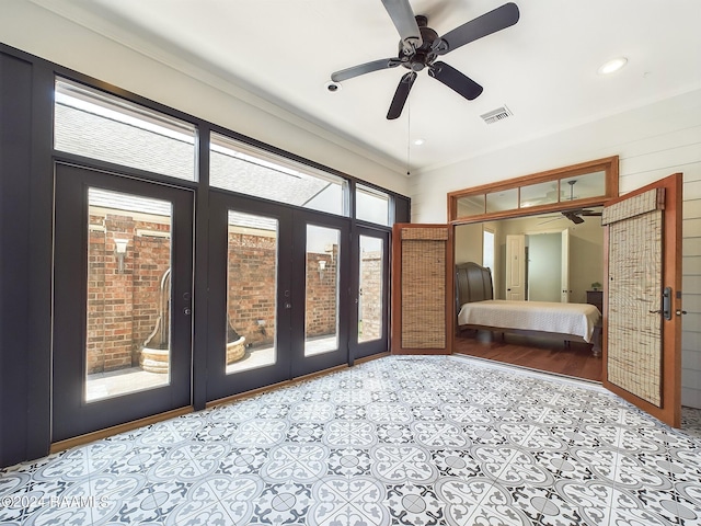 interior space with french doors, ceiling fan, and access to outside