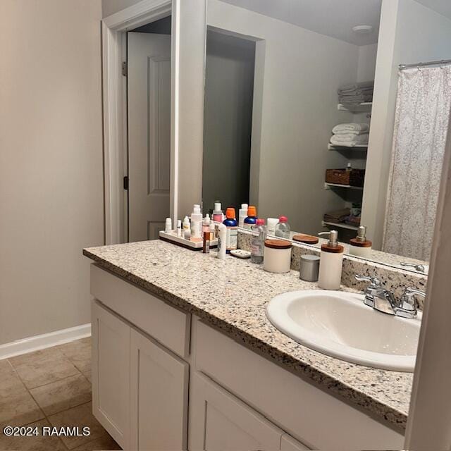 bathroom featuring tile patterned floors and vanity