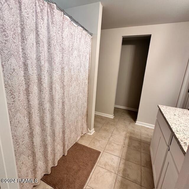 bathroom featuring tile patterned floors and vanity