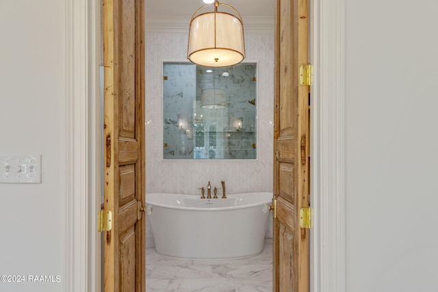 full bath featuring marble finish floor, ornamental molding, a soaking tub, walk in shower, and wallpapered walls