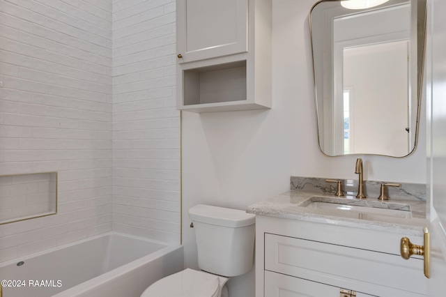 bathroom featuring bathtub / shower combination, vanity, and toilet