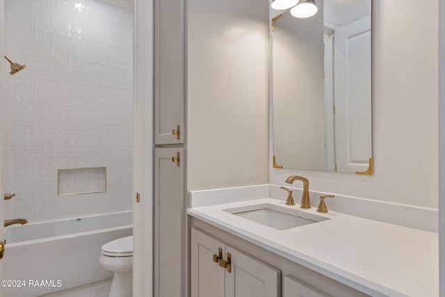 bathroom with shower / tub combination, vanity, and toilet