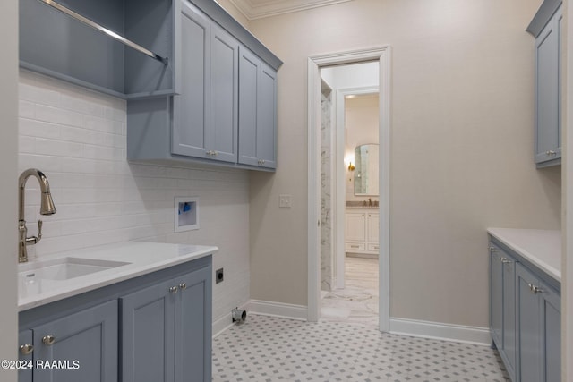 washroom featuring cabinets, hookup for a washing machine, hookup for an electric dryer, ornamental molding, and sink