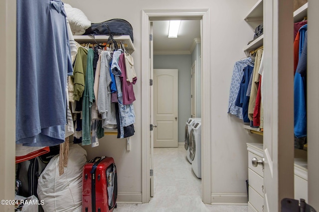 spacious closet featuring washing machine and clothes dryer