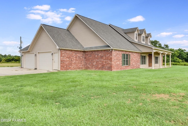 view of home's exterior with a garage and a yard