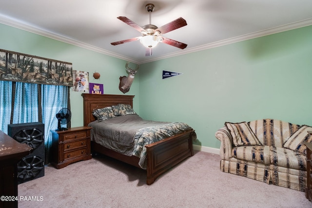 carpeted bedroom with ornamental molding and ceiling fan