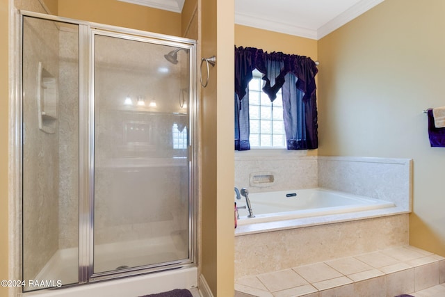 bathroom with ornamental molding and plus walk in shower