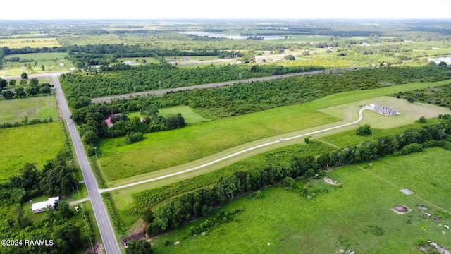 birds eye view of property with a rural view